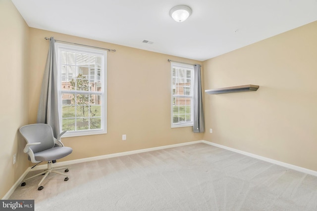 unfurnished room with light colored carpet