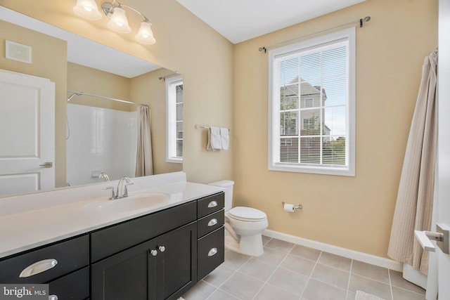 bathroom featuring toilet, a shower with curtain, vanity, and tile patterned flooring