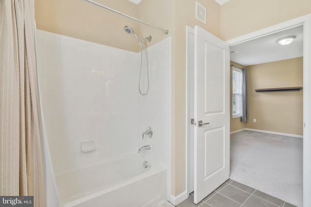 bathroom with tile patterned flooring and shower / bath combination with curtain