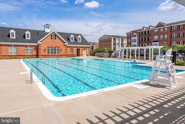 view of swimming pool with a pergola and a patio area