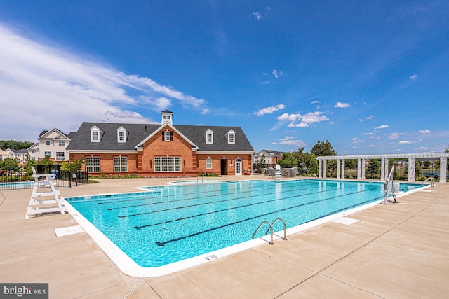 view of pool featuring a patio and a pergola