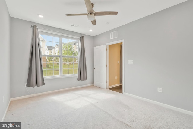 empty room with carpet and ceiling fan