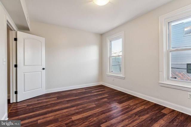 unfurnished room featuring dark hardwood / wood-style floors