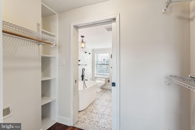 walk in closet featuring tile patterned floors