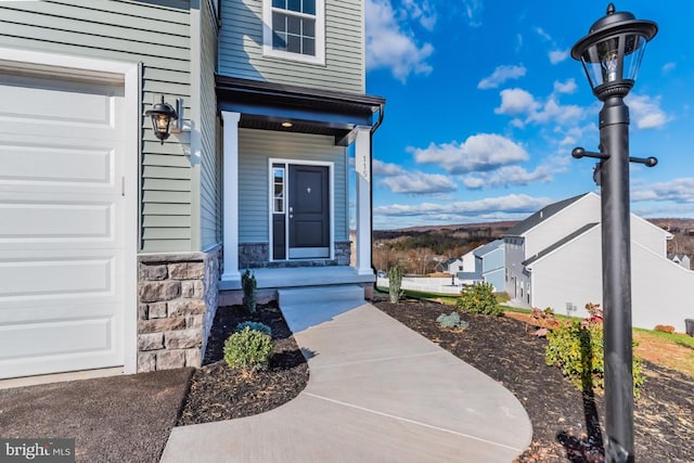 entrance to property featuring a garage