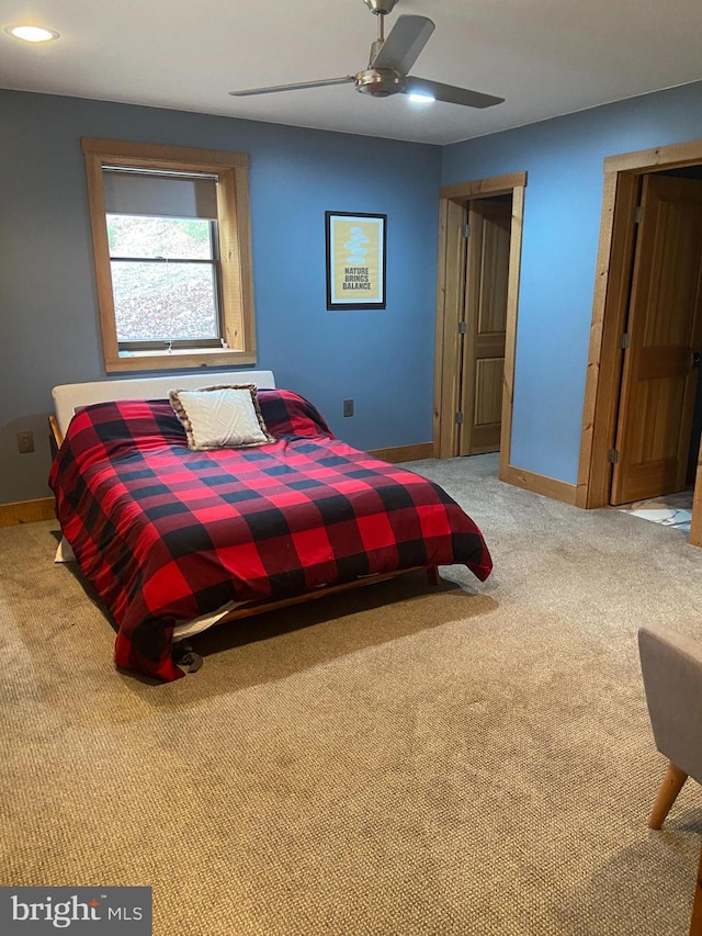 carpeted bedroom with ceiling fan