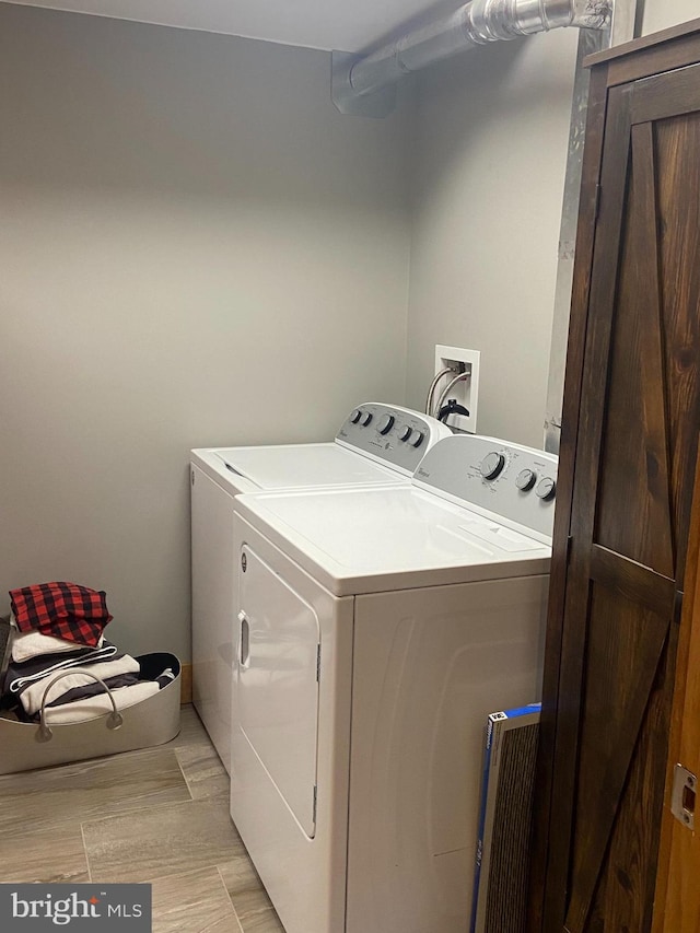 laundry area featuring washing machine and clothes dryer