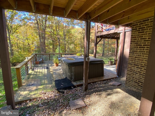 wooden terrace with a hot tub