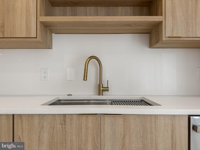 interior details with light brown cabinets and sink