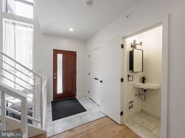 foyer with light hardwood / wood-style flooring