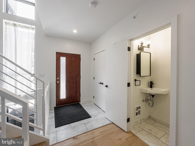 1607 Germantown Ave, Philadelphia, PA 19122 - entrance foyer with baseboards, recessed lighting, stairway, and light marble finish flooring