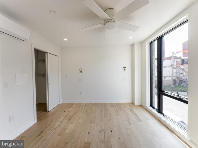 1607 Germantown Ave, Philadelphia, PA 19122 - spare room featuring a wall mounted AC, light wood-type flooring, a ceiling fan, recessed lighting, and baseboards