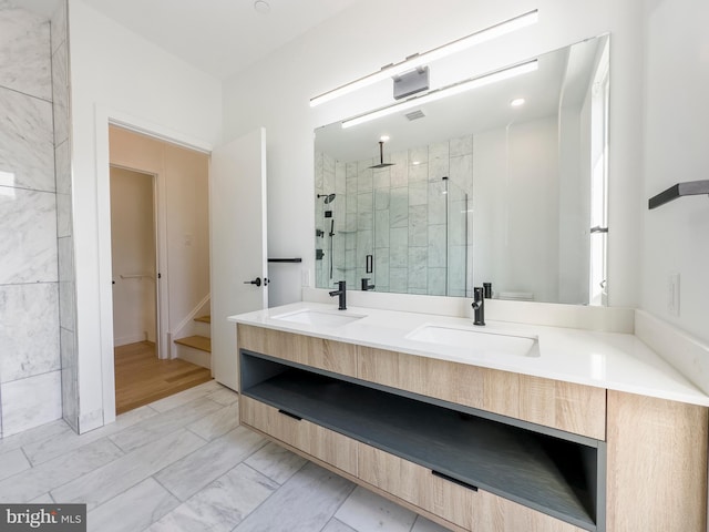 bathroom with hardwood / wood-style floors, walk in shower, vanity, and toilet