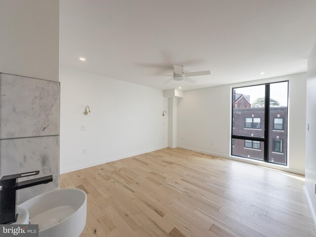 1607 Germantown Ave, Philadelphia, PA 19122 - unfurnished living room featuring a ceiling fan, light wood-style floors, recessed lighting, and baseboards