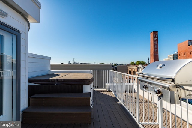 wooden deck featuring grilling area