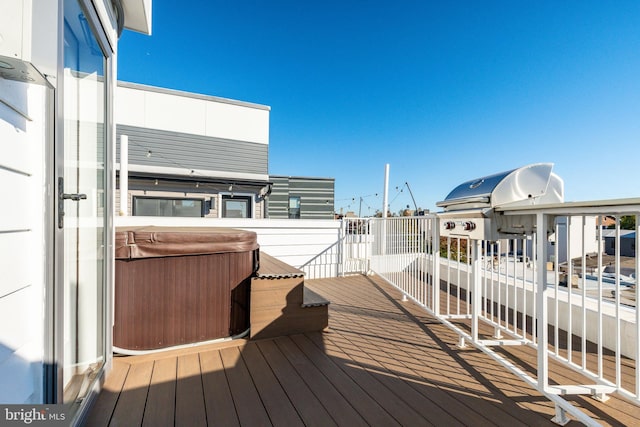 deck featuring a hot tub