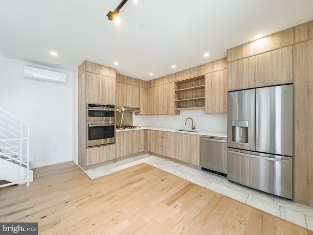 kitchen featuring stainless steel appliances, a wall mounted air conditioner, light brown cabinetry, ventilation hood, and light hardwood / wood-style flooring