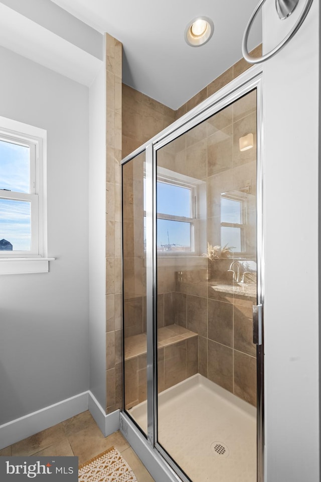 bathroom featuring tile patterned floors and walk in shower