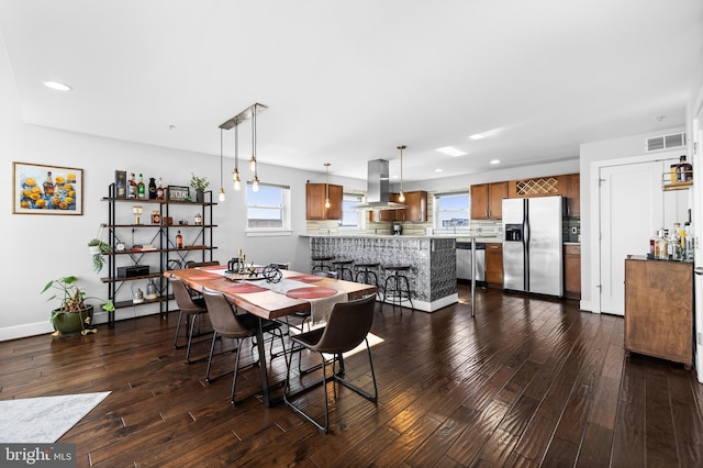 dining room with dark hardwood / wood-style floors