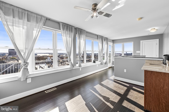 sunroom / solarium with ceiling fan