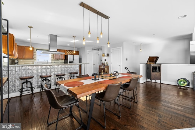 dining space featuring dark hardwood / wood-style floors