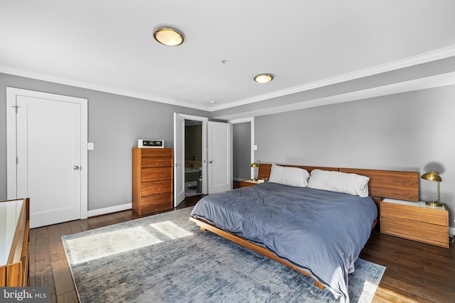 bedroom featuring ornamental molding and dark hardwood / wood-style floors