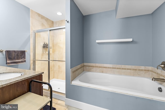 bathroom featuring tile patterned flooring, vanity, and plus walk in shower