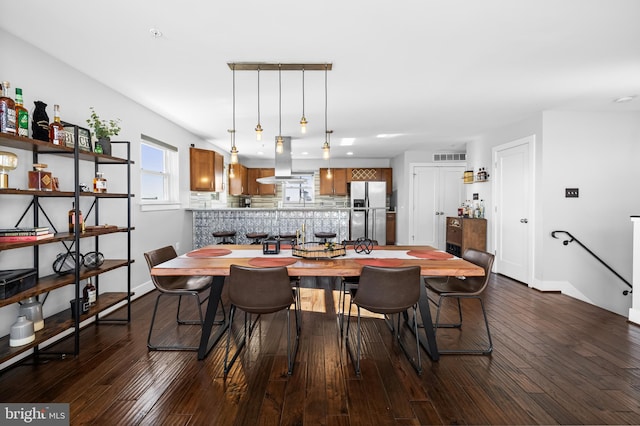 dining area with wood-type flooring