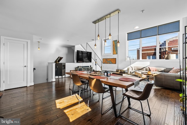 dining room with dark hardwood / wood-style flooring