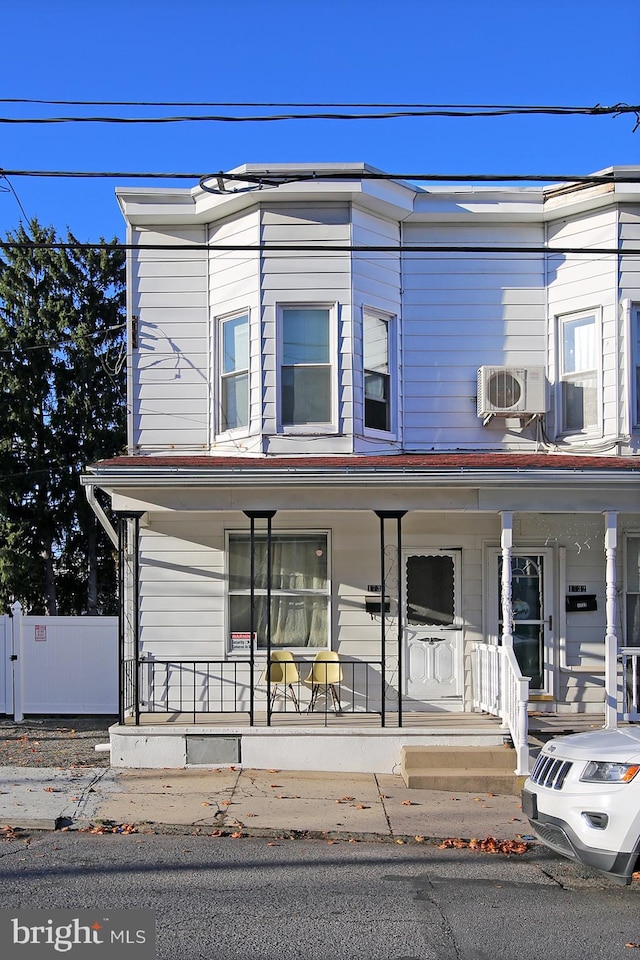 townhome / multi-family property with covered porch