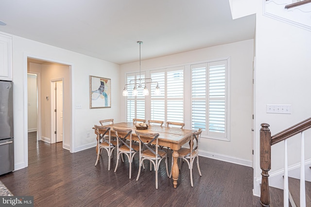 dining area featuring dark hardwood / wood-style floors