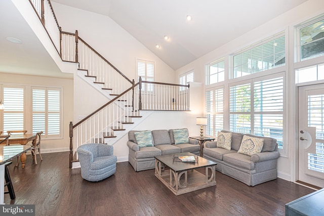 living room featuring plenty of natural light, high vaulted ceiling, and dark hardwood / wood-style floors