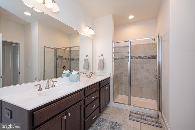 bathroom with vanity, tile patterned floors, and walk in shower