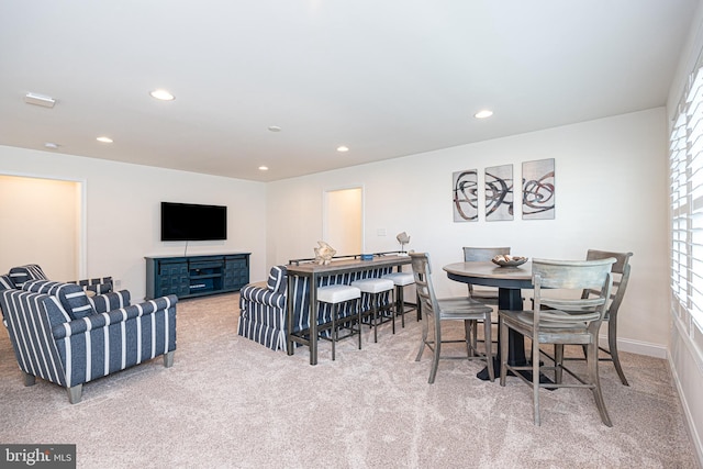 dining space with light colored carpet