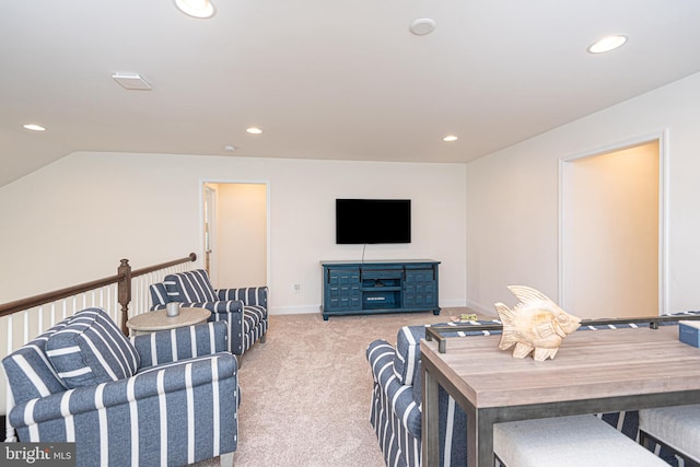 living room featuring light colored carpet and vaulted ceiling