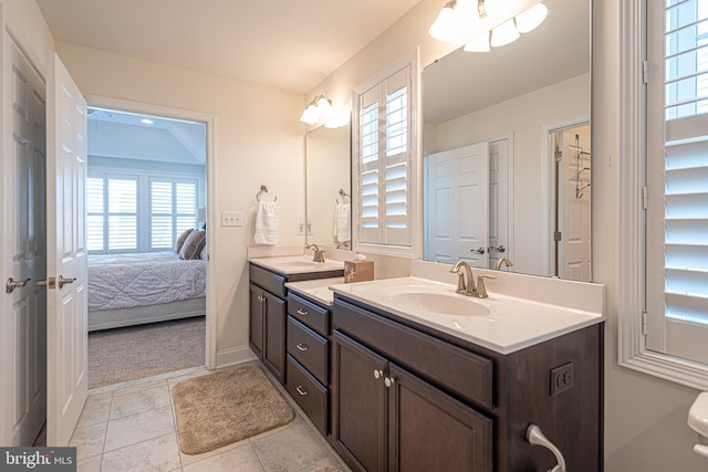 bathroom featuring tile patterned flooring and vanity