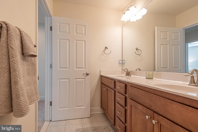 bathroom with tile patterned flooring and vanity