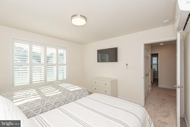 bedroom featuring carpet flooring and a wall mounted AC