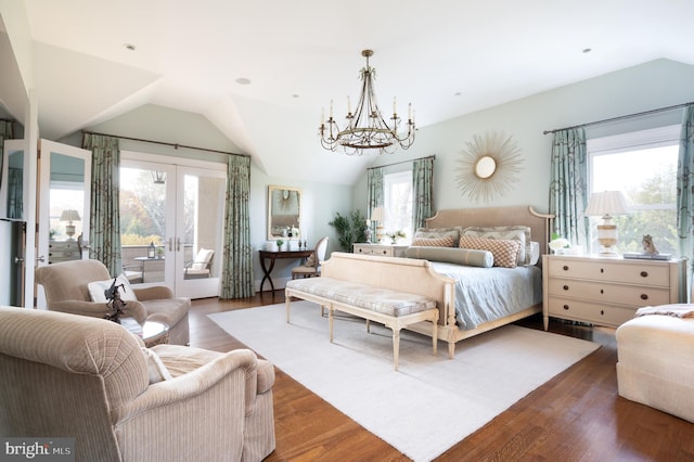 bedroom with dark hardwood / wood-style floors, access to exterior, and multiple windows