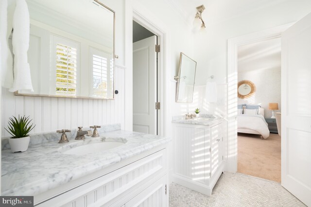 bathroom featuring vanity and crown molding