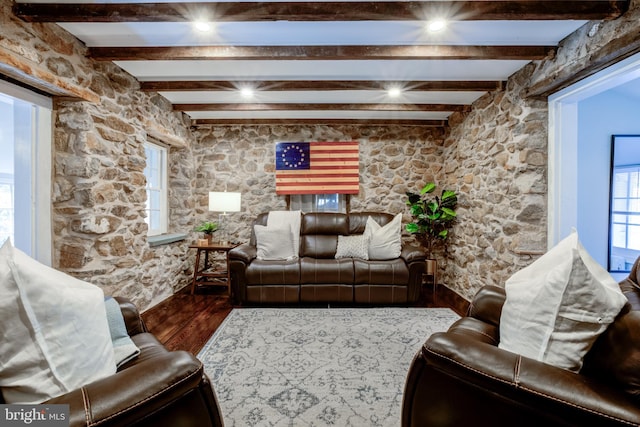 living room with hardwood / wood-style floors and beam ceiling