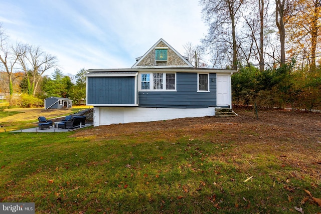 exterior space with a patio area, a storage shed, and a yard