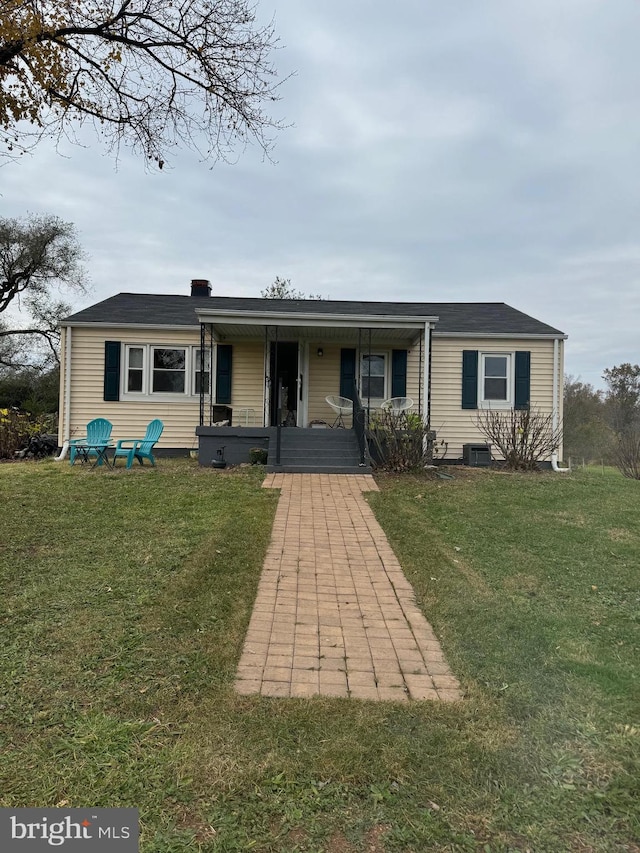 ranch-style home with a porch and a front yard