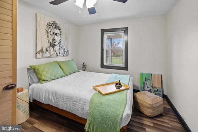 bedroom featuring hardwood / wood-style flooring and ceiling fan