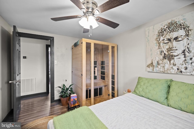 bedroom featuring wood-type flooring and ceiling fan