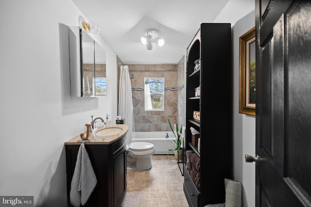 full bathroom featuring shower / tub combo with curtain, vanity, and toilet