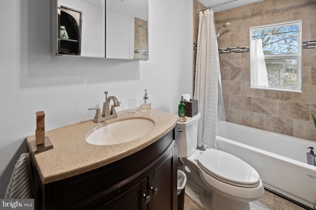 full bathroom featuring vanity, shower / bath combo, and toilet