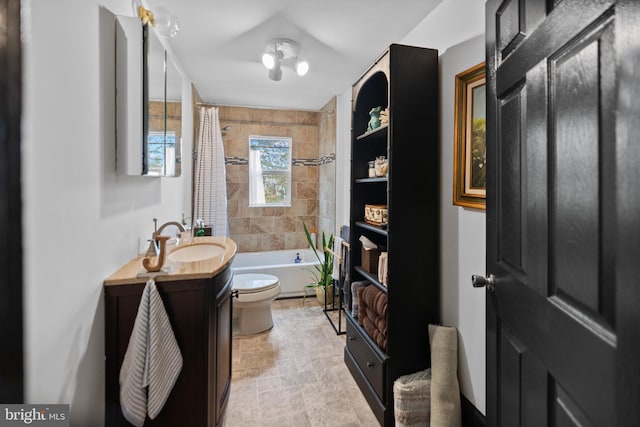 full bathroom with vanity, toilet, and shower / tub combo