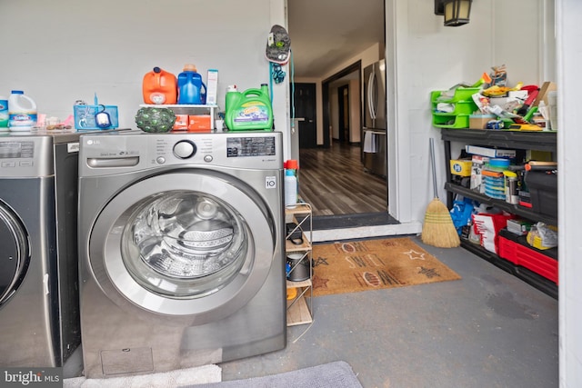 washroom with washing machine and dryer