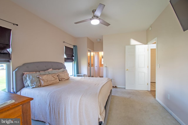 bedroom featuring light carpet and ceiling fan